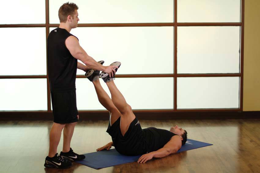 Demonstration of Adductor/Groin exercise showing proper form and technique