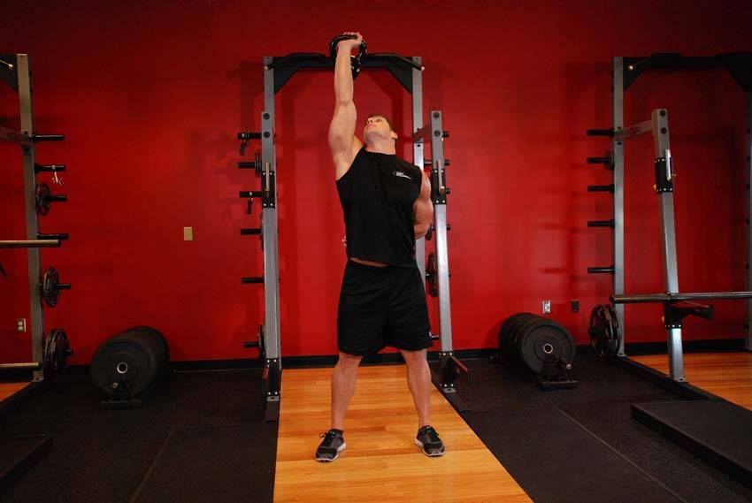 Demonstration of Advanced Kettlebell Windmill exercise showing proper form and technique