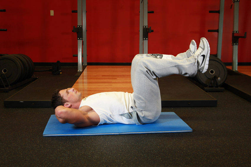 Demonstration of Air Bike exercise showing proper form and technique