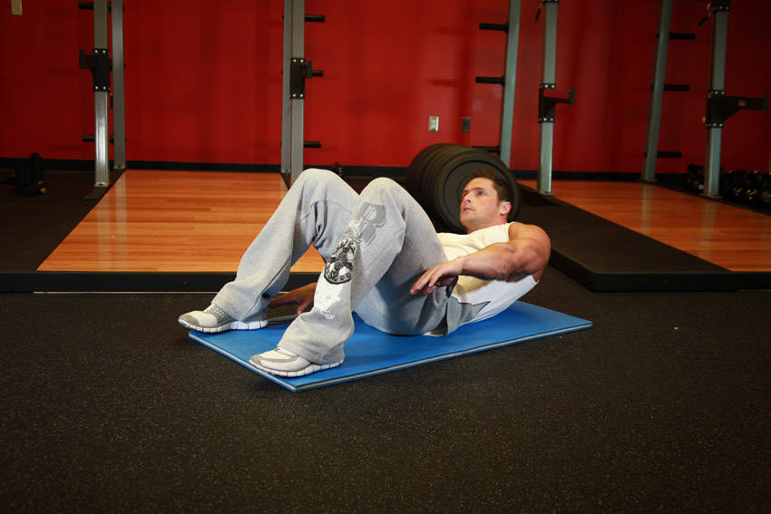 Demonstration of Alternate Heel Touchers exercise showing proper form and technique