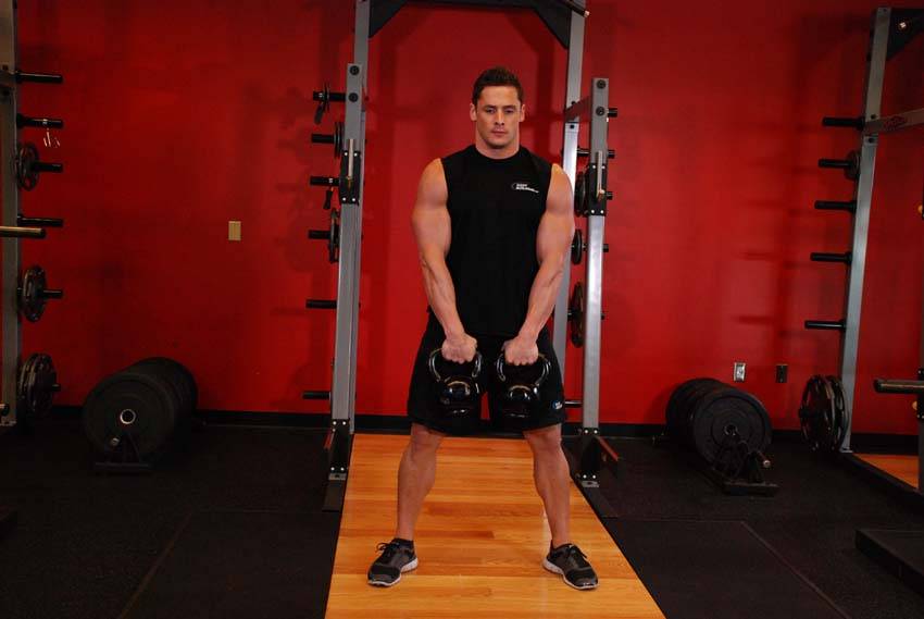 Demonstration of Alternating Hang Clean exercise showing proper form and technique