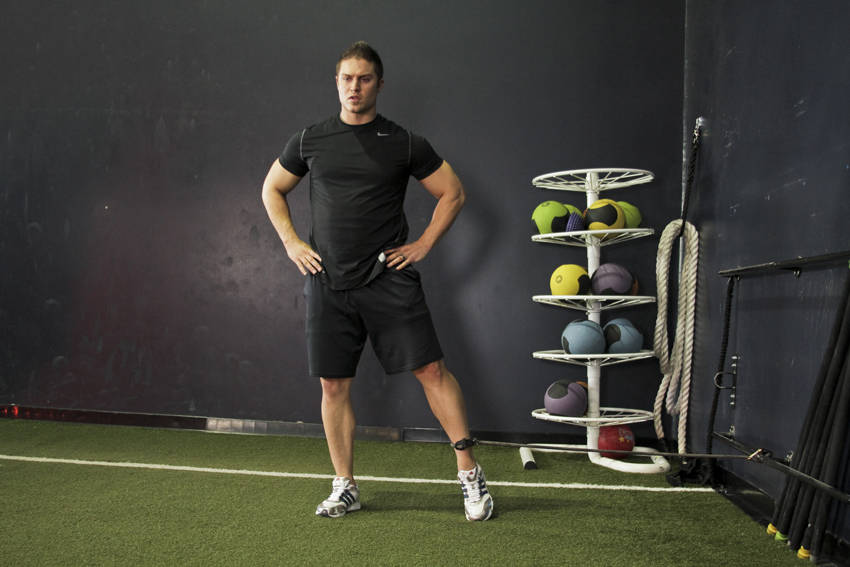 Demonstration of Band Hip Adductions exercise showing proper form and technique