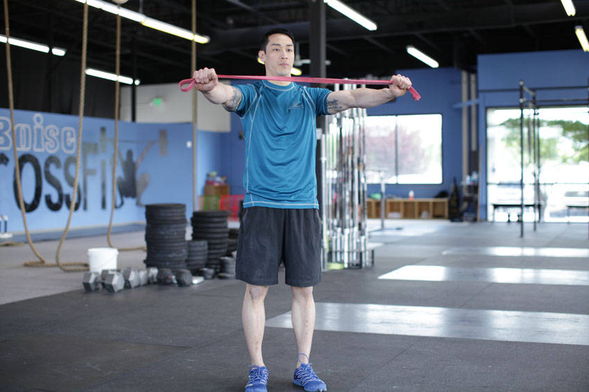 Demonstration of Band Pull Apart exercise showing proper form and technique