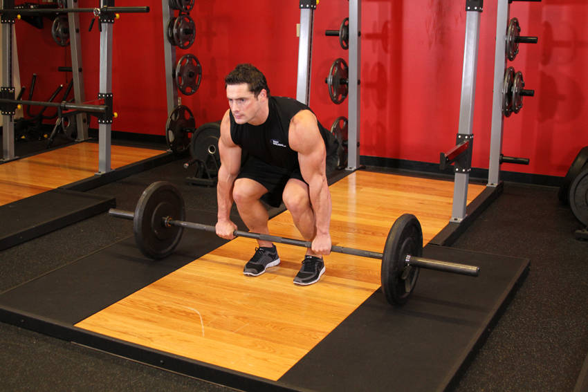 Demonstration of Barbell Deadlift exercise showing proper form and technique