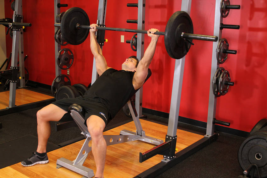 Demonstration of Barbell Incline Bench Press - Medium Grip exercise showing proper form and technique