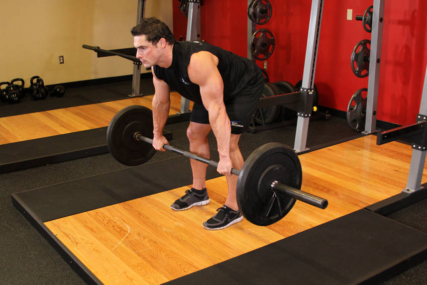Demonstration of Barbell Rear Delt Row exercise showing proper form and technique