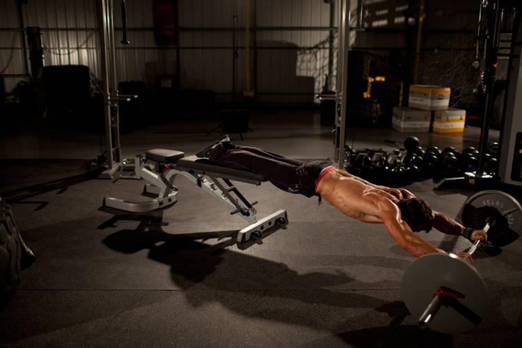 Alternative demonstration of Barbell Rollout from Bench exercise