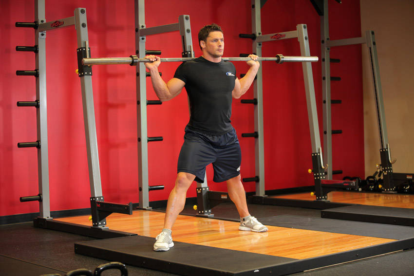 Demonstration of Barbell Side Split Squat exercise showing proper form and technique