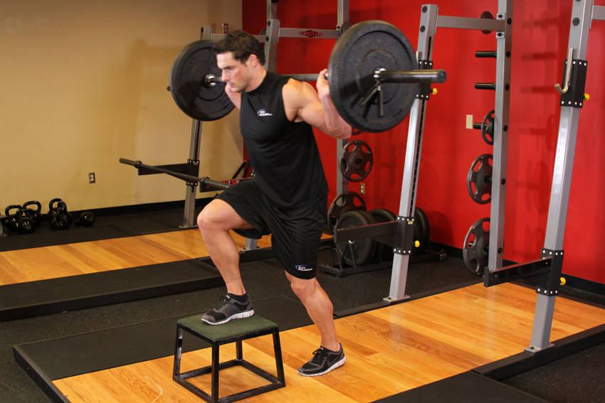 Demonstration of Barbell Step Ups exercise showing proper form and technique
