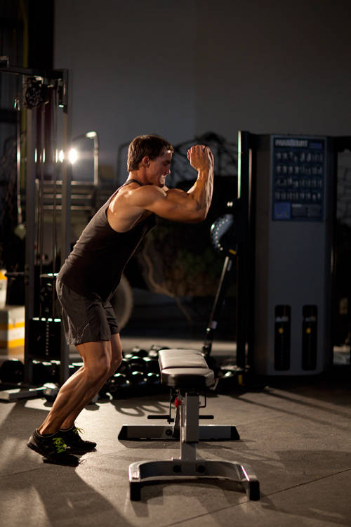 Demonstration of Bench Jump exercise showing proper form and technique