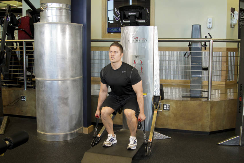 Demonstration of Cable Deadlifts exercise showing proper form and technique