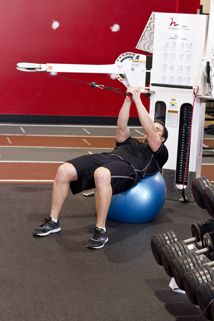 Demonstration of Cable Russian Twists exercise showing proper form and technique