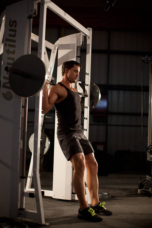 Demonstration of Chair Squat exercise showing proper form and technique