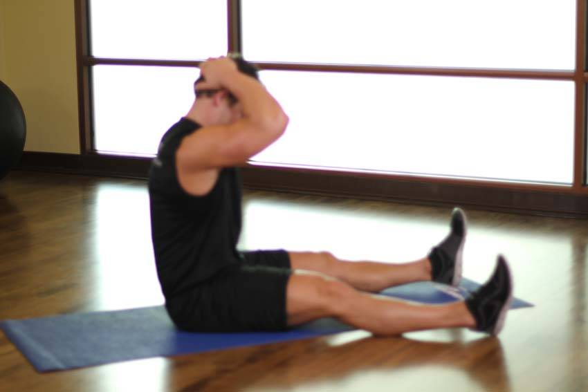 Demonstration of Chin To Chest Stretch exercise showing proper form and technique