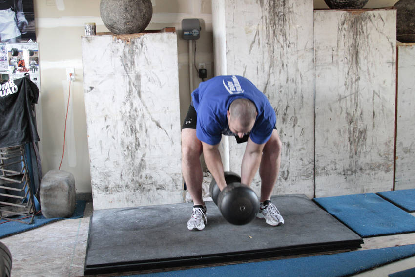 Demonstration of Circus Bell exercise showing proper form and technique