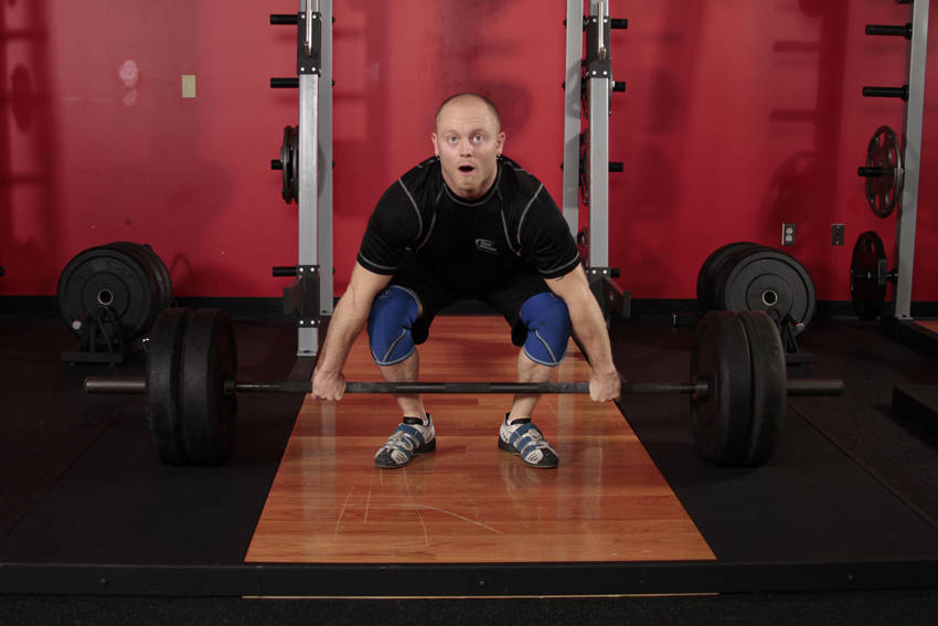 Demonstration of Clean exercise showing proper form and technique