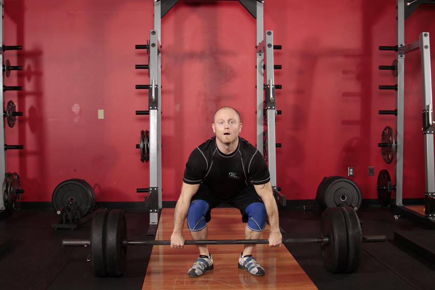 Demonstration of Clean Deadlift exercise showing proper form and technique