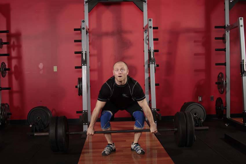 Demonstration of Clean Pull exercise showing proper form and technique