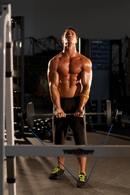 Demonstration of Close-Grip EZ-Bar Curl with Band exercise showing proper form and technique