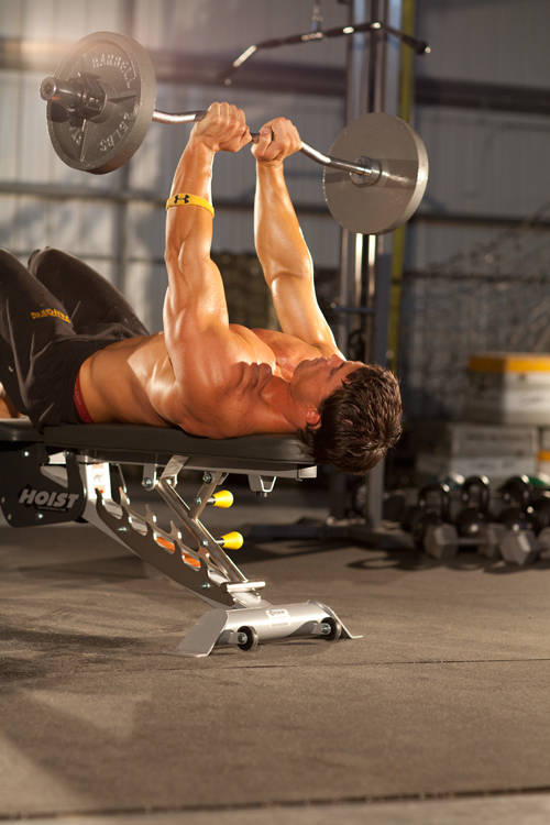 Demonstration of Close-Grip EZ-Bar Press exercise showing proper form and technique