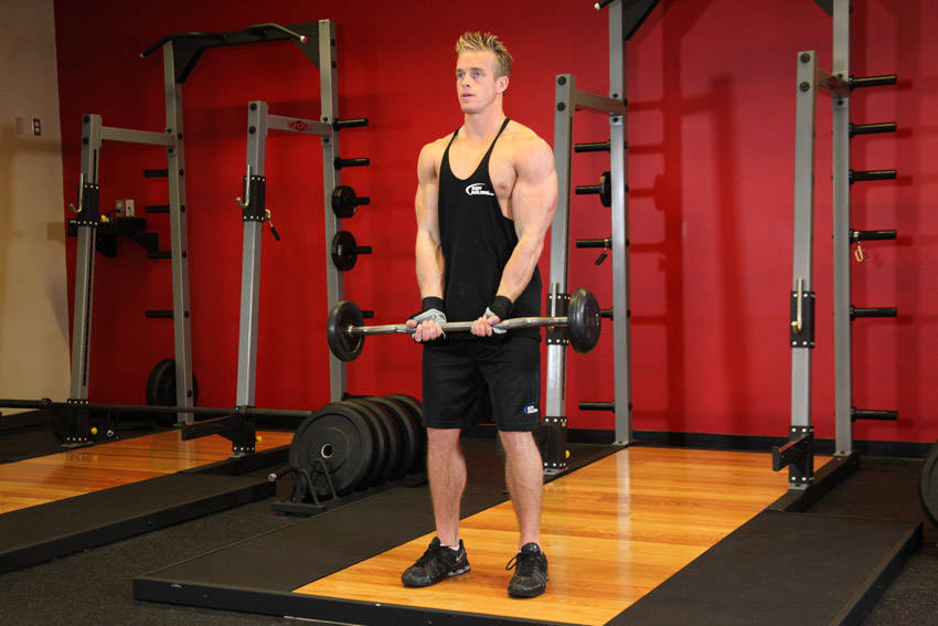Demonstration of Close-Grip EZ Bar Curl exercise showing proper form and technique
