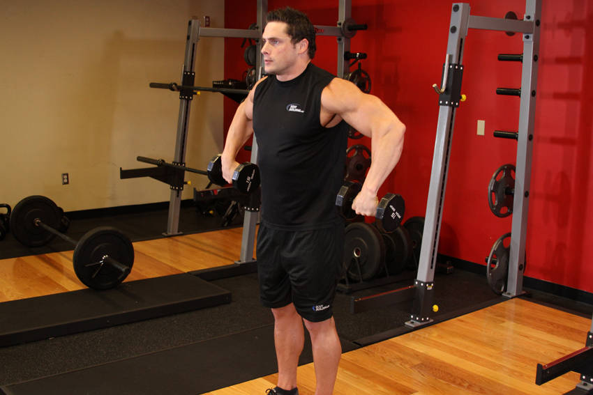 Demonstration of Cuban Press exercise showing proper form and technique