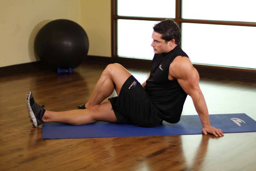 Demonstration of Dancer's Stretch exercise showing proper form and technique