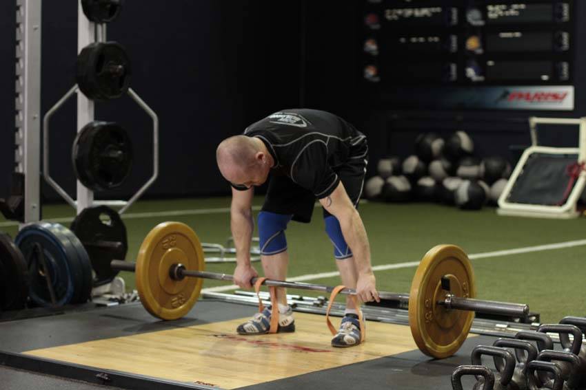 Demonstration of Deadlift with Bands exercise showing proper form and technique