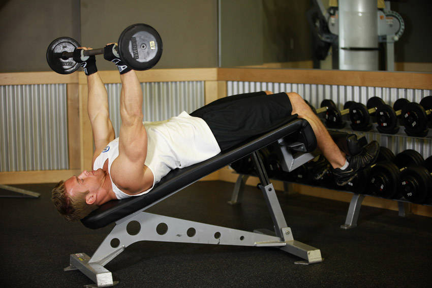 Demonstration of Decline Close-Grip Bench To Skull Crusher exercise showing proper form and technique