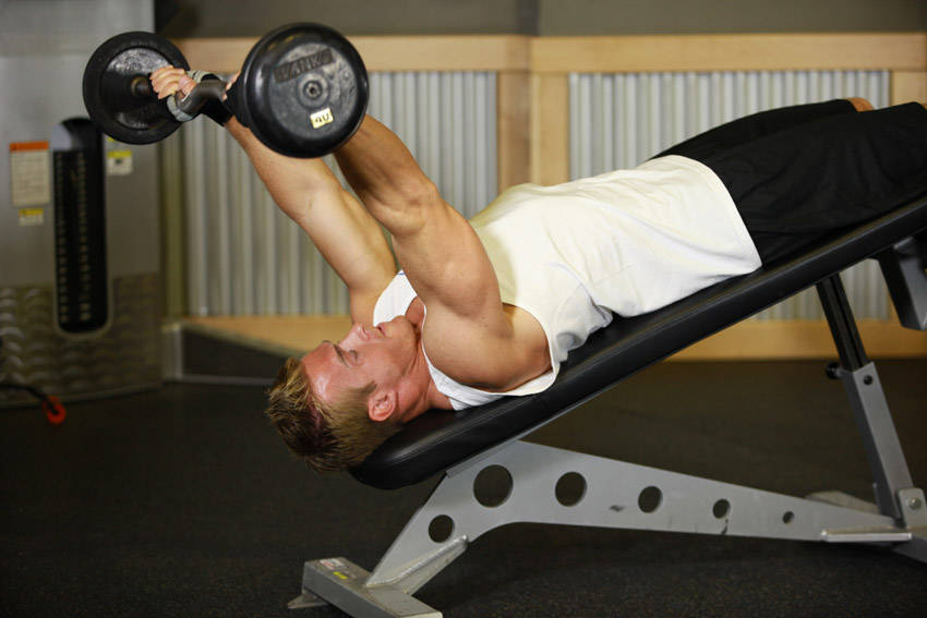 Demonstration of Decline EZ Bar Triceps Extension exercise showing proper form and technique