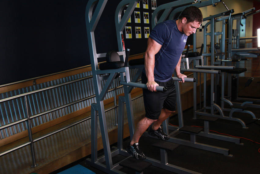 Demonstration of Dips - Chest Version exercise showing proper form and technique