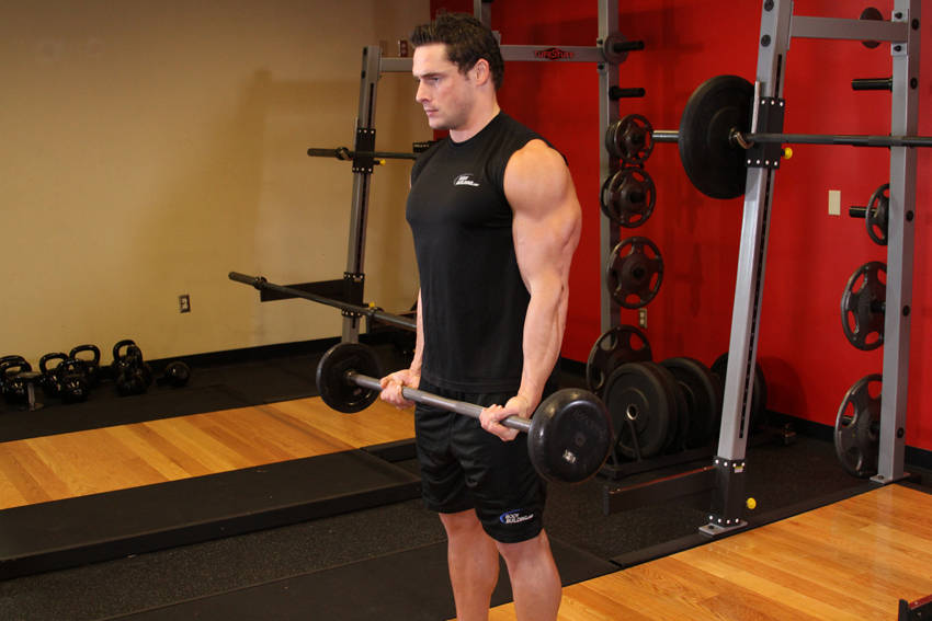 Demonstration of Drag Curl exercise showing proper form and technique