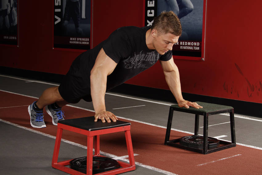 Demonstration of Drop Push exercise showing proper form and technique