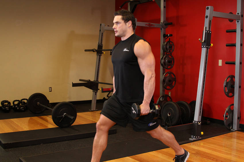 Demonstration of Dumbbell Lunges exercise showing proper form and technique