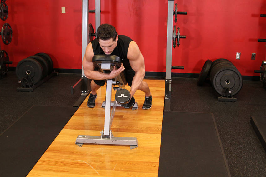 Demonstration of Dumbbell Lying One-Arm Rear Lateral Raise exercise showing proper form and technique