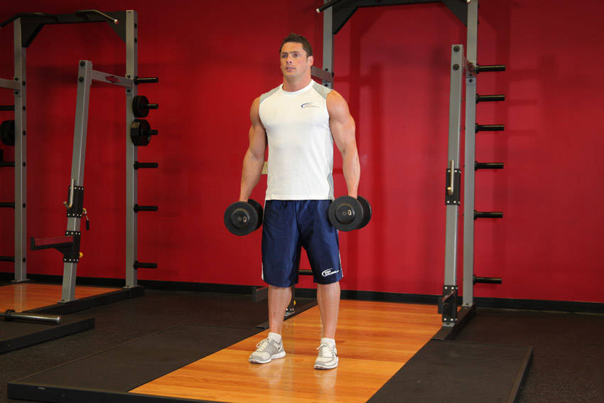 Demonstration of Dumbbell Squat exercise showing proper form and technique