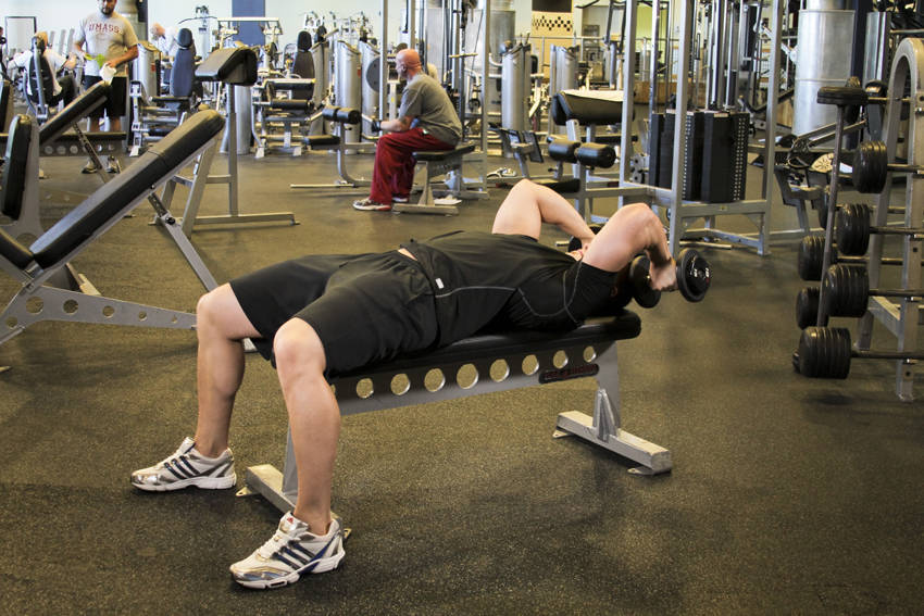 Demonstration of Dumbbell Tricep Extension -Pronated Grip exercise showing proper form and technique