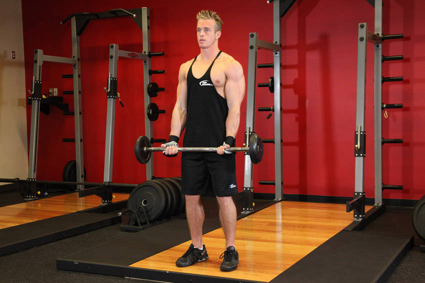 Demonstration of EZ-Bar Curl exercise showing proper form and technique
