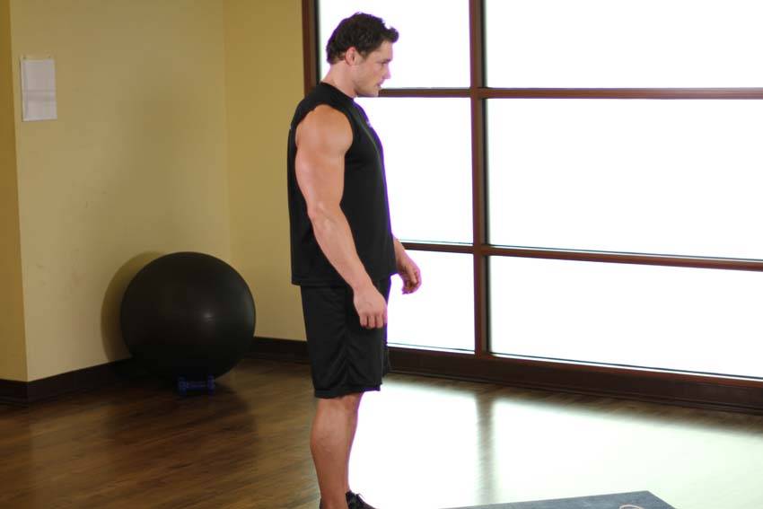 Demonstration of Elbows Back exercise showing proper form and technique