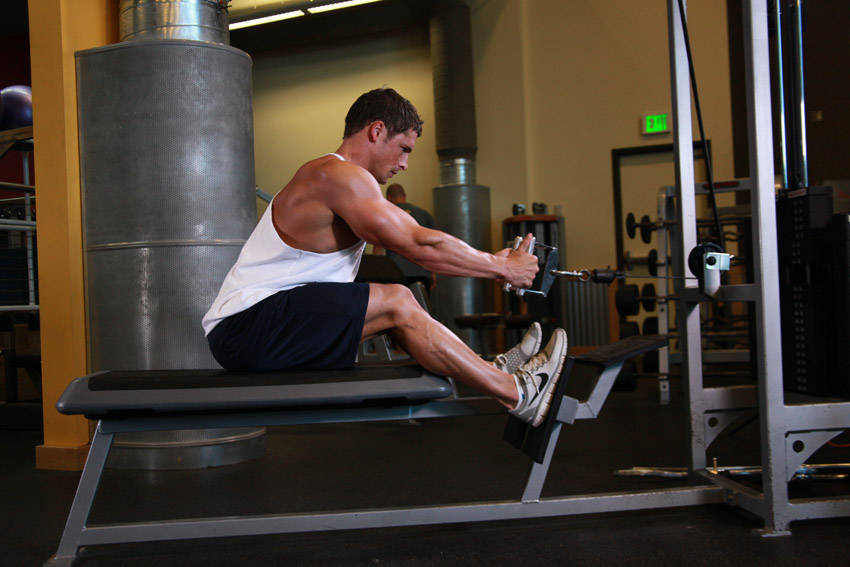 Demonstration of Elevated Cable Rows exercise showing proper form and technique