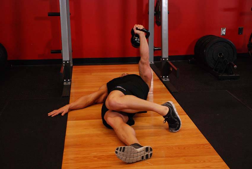 Alternative demonstration of Extended Range One-Arm Kettlebell Floor Press exercise