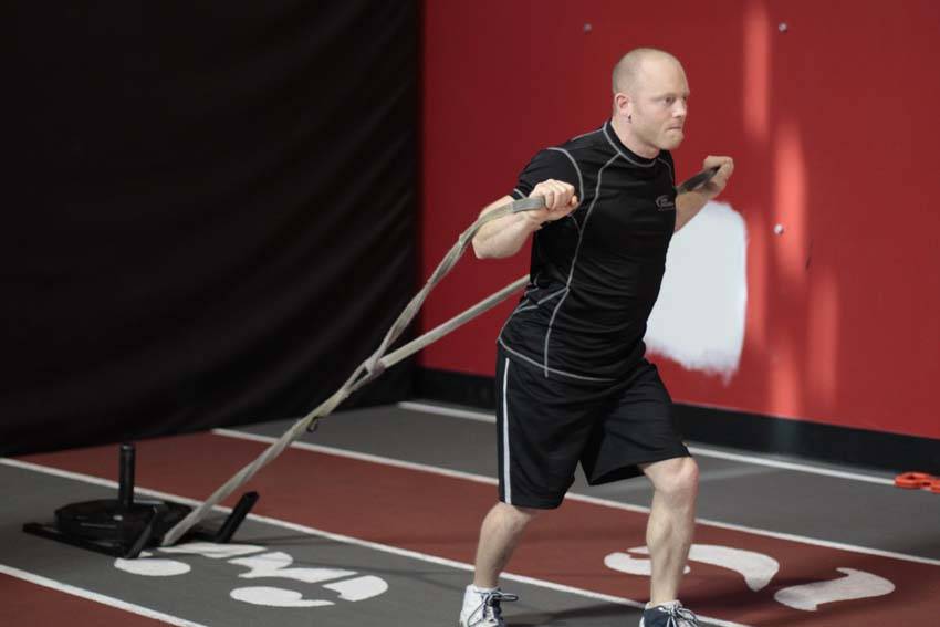 Demonstration of Forward Drag with Press exercise showing proper form and technique
