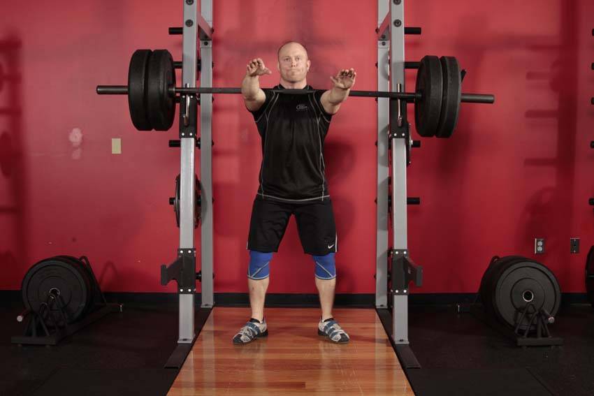Demonstration of Frankenstein Squat exercise showing proper form and technique