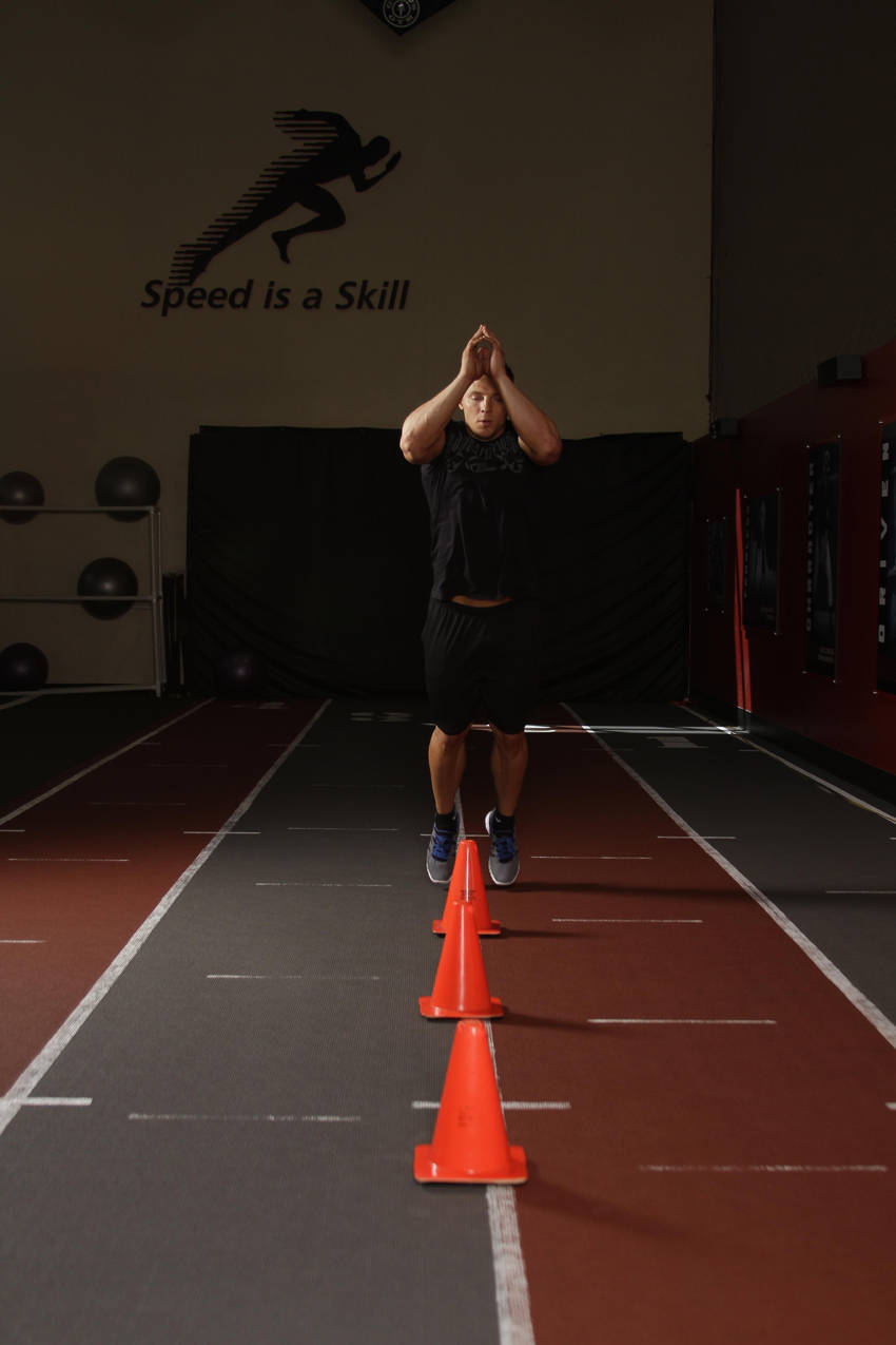 Demonstration of Front Cone Hops (or hurdle hops) exercise showing proper form and technique