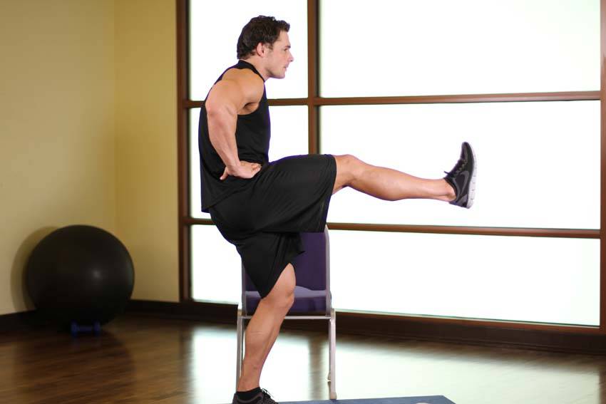 Demonstration of Front Leg Raises exercise showing proper form and technique
