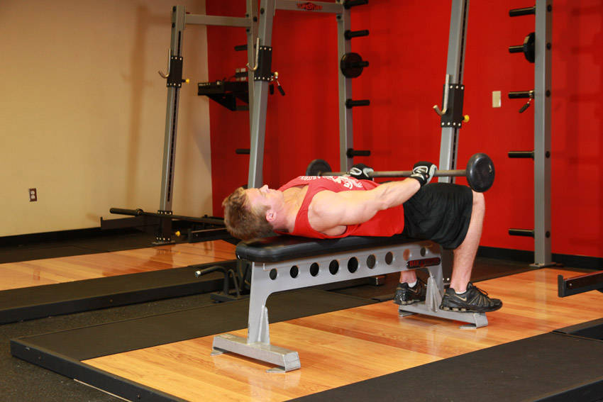 Demonstration of Front Raise And Pullover exercise showing proper form and technique