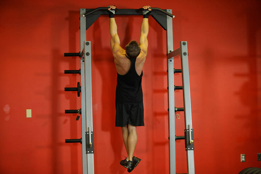 Demonstration of Gironda Sternum Chins exercise showing proper form and technique