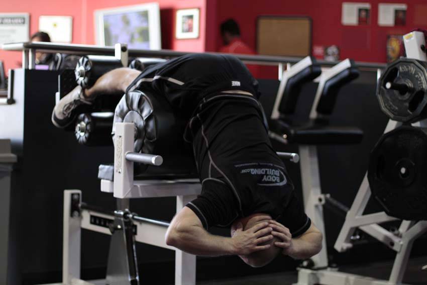 Demonstration of Glute Ham Raise exercise showing proper form and technique