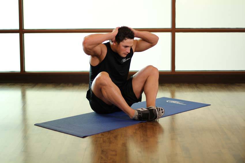Demonstration of Groin and Back Stretch exercise showing proper form and technique