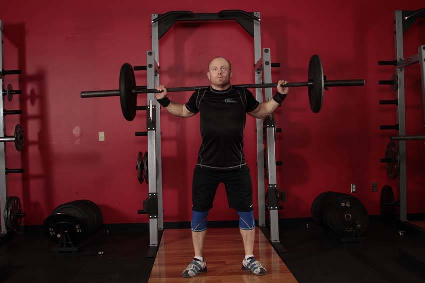Demonstration of Heaving Snatch Balance exercise showing proper form and technique